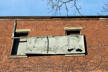 Abandoned brick building with peeling paint 