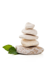 Balancing stones on white.