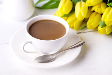 Beautiful Yellow Tulips on White Wooden Background Cup of Coffee Breakfast Morning Holiday Birthday Composition Close Up