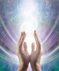 Sensing Spiralling Healing Energy - male  hands reaching up and sensing an ethereal spiralling white light flowing energy form with copy space 
