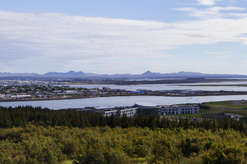 Panorama of Reykjavik, lake and houses side view