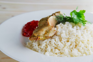 Pork shaslyk with rice and tomato sauce