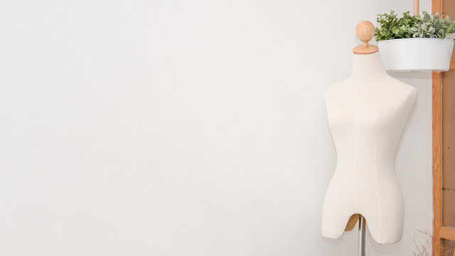 Fashion design woman mannequin in white room