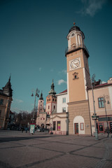 Fototapeta na wymiar A vertical color image of Banska Bystrica Old Town, Main Square and Clock Tower. Captured Banska Bystrica, Slovakia