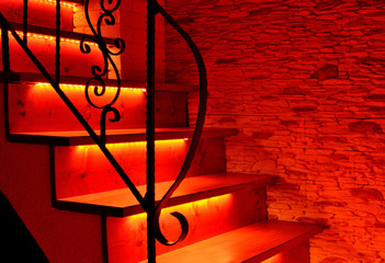 Red night LED lighting wooden stairs
