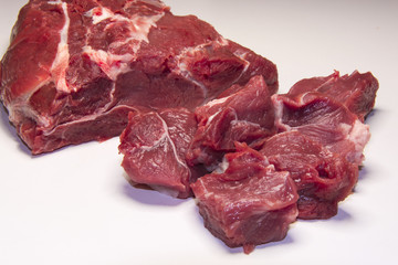 Raw pieces of beef meat for stew , goulash or ragout