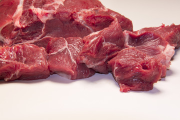 Raw pieces of beef meat for stew , goulash or ragout