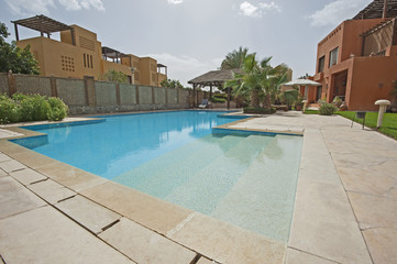 Swimming pool and exterior of a luxury tropical holiday villa