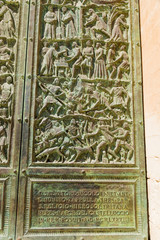 Noto, Sicily, Italy. The lower part of the bronze bas-relief of the doors on the facade of the Cathedral with the image of the life of Saint Corrado, 1982