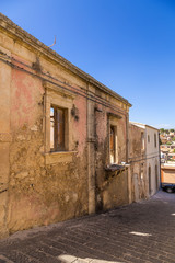 Fototapeta na wymiar Noto, Sicily, Italy. Ancient buildings on one of the streets of the historic center