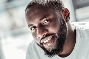 Happy face. Portrait of a handsome nice bearded man smiling and looking at you