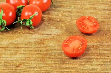 Group of traditional Italian tomatoes pachino on wooden background.