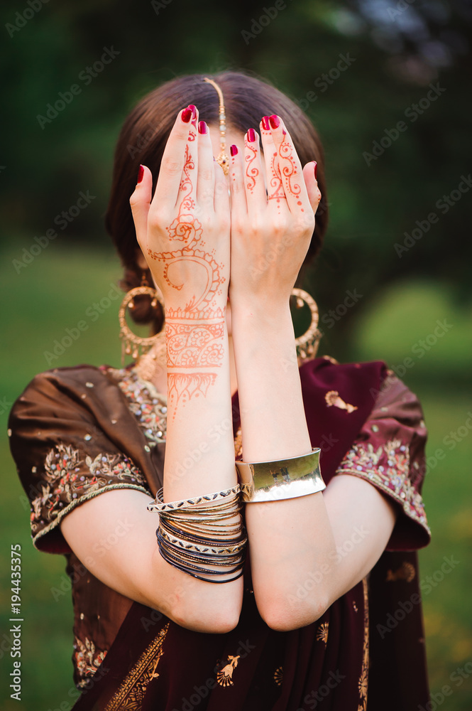 Wall mural mehndi covers hands of indian woman - Wall murals