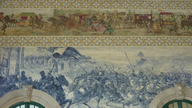 Historic azulejo tiles at S&atilde;o Bento Railway Station in Porto, Portugal.