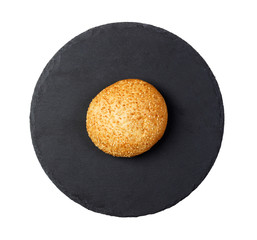 Fototapeta na wymiar butter bread roll on a plate on white background