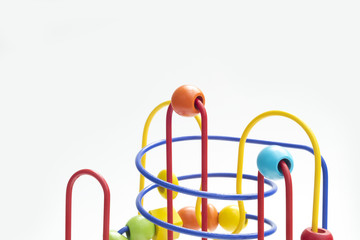 Colorful toy for preschoolers consisting of an iron structure and several balls