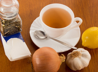 Cup of tea, handkerchiefs, onion, garlic, lemon