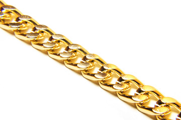 Closeup of gold jewelry chain necklace isolated on white