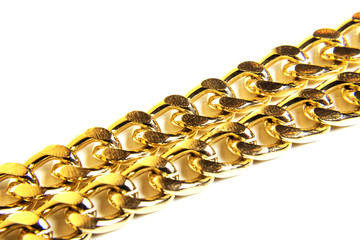 Closeup of gold jewelry chain necklace isolated on white