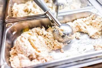 Chicken salad in buffet tray container metal, restaurant with scoop, white shredded meat, mayonnaise