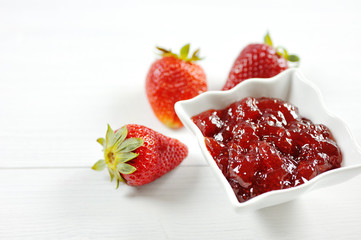 Red strawberries fruit and jam