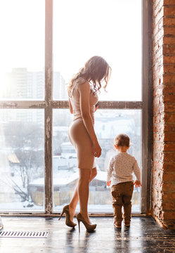 Mother and son together near big window