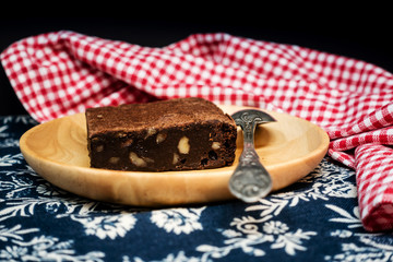 Chocolate Brownie cake on a dark plate