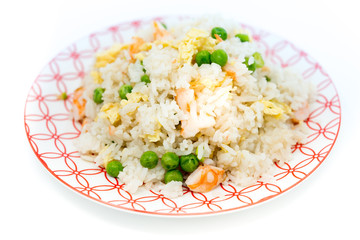 Homemade Chinese fried rice with vegetables and fried eggs