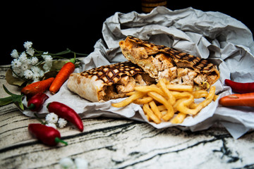 Mexican fajita wraps with grilled chicken fillet and fresh vegetables