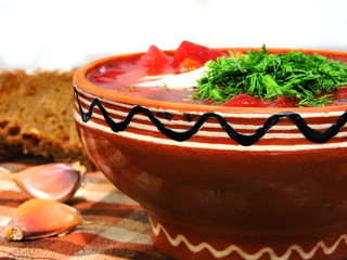 Ukrainian vegetarian borscht with sour cream and greens.  appetizerbackgroundbeetbeetrootborschborschtborshchbowlbreadbrightcabbagecarrotcookingcreamcuisinedeliciousdinnerdishfitness foodfoodgarlicgou