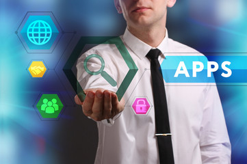 Business, Technology, Internet and network concept. Young businessman working on a virtual screen of the future and sees the inscription: APPS