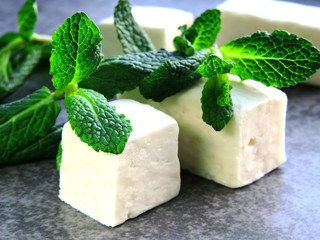 Peppermint candy and mint leaves. Mint chewing sweets.