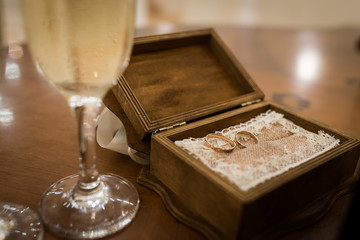 Gold wedding rings in a wooden box