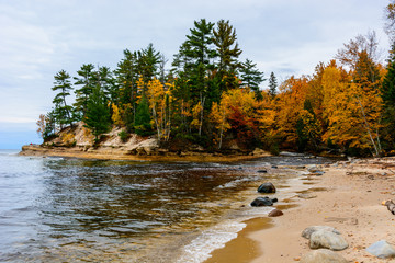 Stone coast in Pictured Rocks National Lakeshore, USA. Autumn forest on coast. © VirtualV