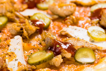 Appetizing food background with pickled cucumbers, sauce and meat