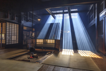 Traditional japanese fireplace, with ray of sun in smoke, in tsumago, japan.