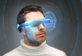 man in 3d glasses with virtual hologram
