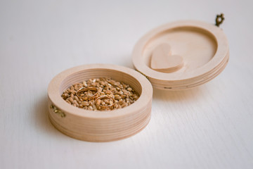 Wedding rings in wheat, wedding ring giving