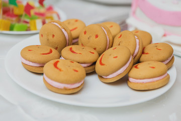 Funny cookies with smiles, sweets on the table