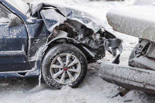 Crashed cars in accident on winter road