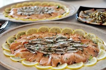 Marinated salmon and anchovies - seafood appetizer
