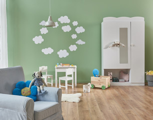 decorative interior baby room style with grey furniture and white cloud style. white cabinet in the room.