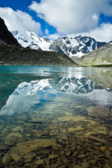 Fototapeta na wymiar Beautifull valley with view to mountains and turquoise lake