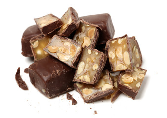 chocolate toffee with peanut filling isolated on white background