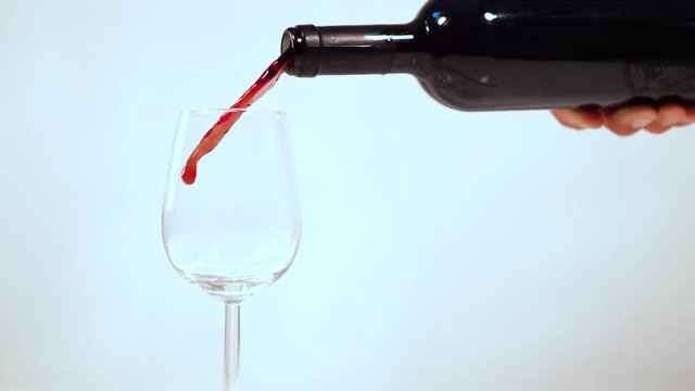 Red wine being poured into a glass