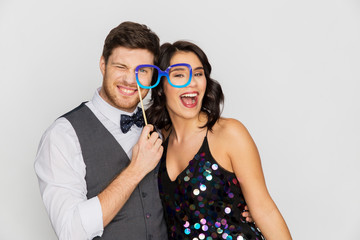 happy couple with party glasses having fun