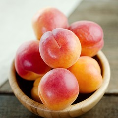 Ripe peaches fresh fruit in a bowl