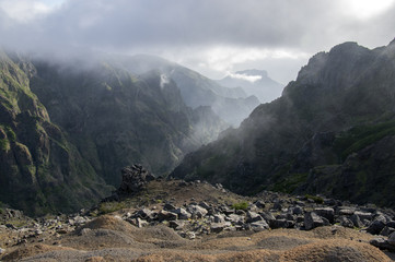 Pico do Arieiro hiking trail, amazing magic landscape with incredible views, rocks and mist, view of the valley between rocks