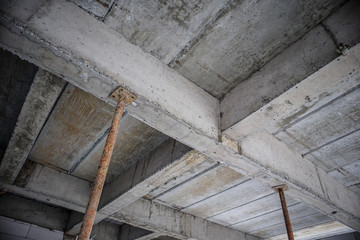 building under construction with iron steel support concrete beams