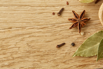 Composition of different sorts of spicies on wooden table background, selective focus, shallow depth of field